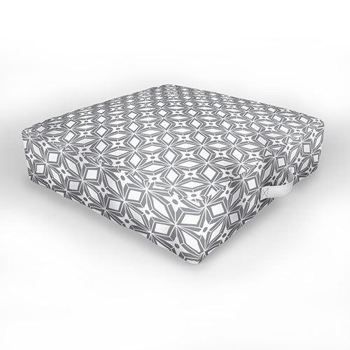 https://shoplivinggardens.com/cdn/shop/products/heather-dutton-starbust-grey-outdoor-floor-cushion-white-background_1445x.jpg?v=1646354561