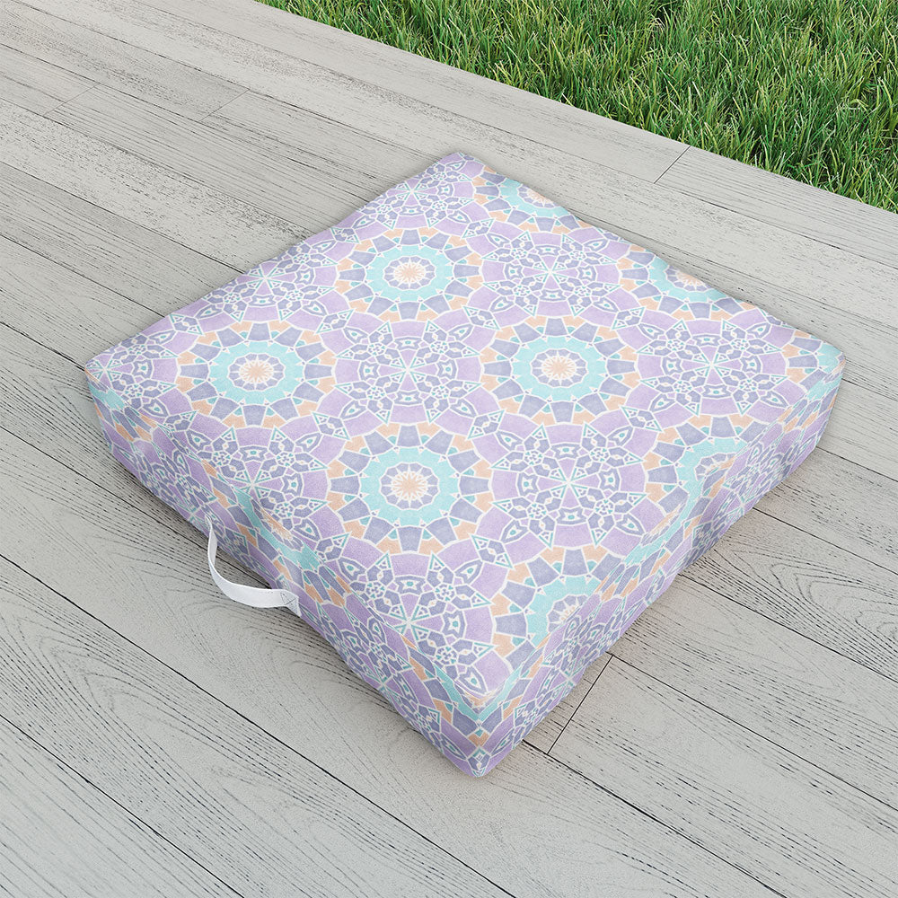 https://shoplivinggardens.com/cdn/shop/products/kaleiope-studio-colorful-pastel-ornate-pattern-outdoor-floor-cushion-lifestyle_1445x.jpg?v=1646354561